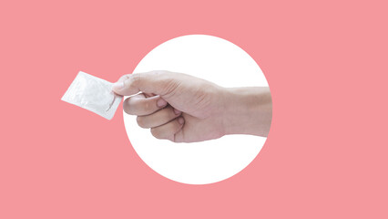 Man hands giving a condom isolated on a pink color background. abstact style. safe sex concept. Modern design