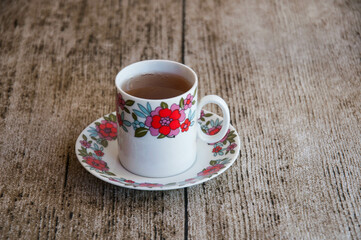 cup of coffee on wooden table