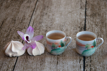 cup of tea with meringues