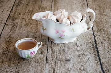 cup of tea with marshmallows on the table