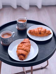 breakfast with croissant and coffee
