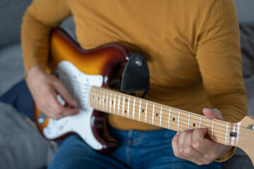 Fototapeta na wymiar close up of man playing guitar