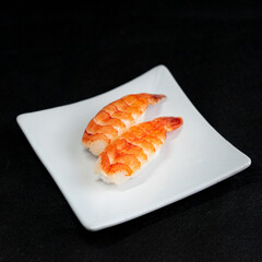Ebi sushi, Japanese shrimp on Japanese rice. Japanese tradition food cuisine style with black background