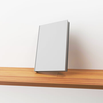 hard cover blank white book on wooden cupboard, 3d rendering, for your mock up design 