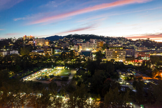 Baguio City, Philippines -  Evening aerial of Burnham Park and surrounding hotels.