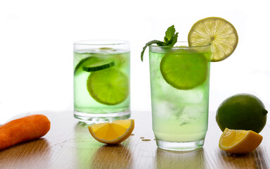 Classic gin tonic cocktails on bar counter in pub or restaurant against on white background.