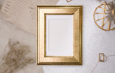 mockup gold photo frame on white stone round table with sunlight