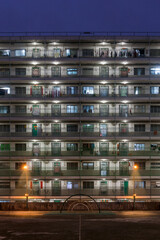 Night view of Aged Public Rental Housing Estate in Shek Kip Mei in Hong Kong with climbing frame at playground
