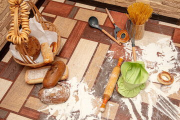 Bread, flour and a rolling pin in the kitchen.