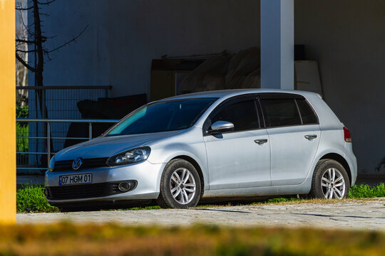 Side, Turkey – january 23 2023:    gray Volkswagen Golf  is parked  on the street on a warm summer day