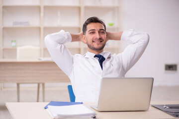 Young male doctor working at the hospital