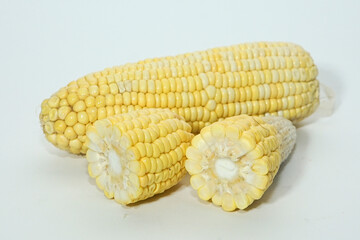 Cut fresh sweet corn isolated on white background