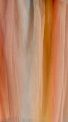 veil of ocher orange fabric pastel textile texture with large folds linen natural cotton decorative...