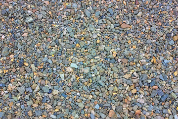 Crushed close up different granite stone texture background.