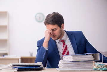 Young male employee working in the office