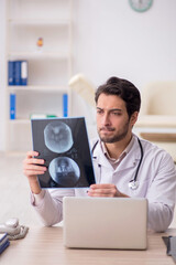 Young male doctor radiologist working in the clinic