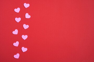 Valentine's Day  red background with  pink hearts.  Love and relationships concept. Copy space