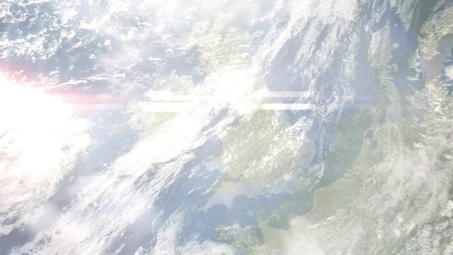 Earth zoom in from outer space to city. Zooming on Llandudno, UK. The animation continues by zoom out through clouds and atmosphere into space. Images from NASA