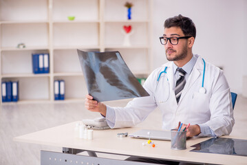 Young male doctor radiologist working in the clinic