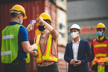 staff are checking a fever of logistic worker at container industry and cargo port, engineer and foreman, export, working in business shipping industrial, coronavirus protection process
