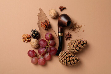 Concept of smoking, smoking pipe, concept on beige background