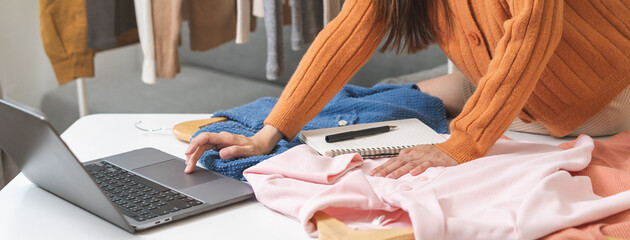 Designer, stylist work asian young woman hand using computer laptop, check order design clothes,...