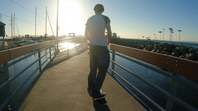 Longboarding Follow Cam on Waterfront Marina Boardwalk