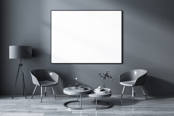 Front view on blank white poster in black frame on dark wall background in stylish grey shades living room with vintage lamp, glossy chairs and coffee table on wooden floor. 3D rendering, mockup