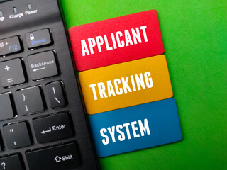 Black wireless keyboard with the word APPLICANT TRACKING SYSTEM