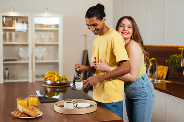 modern multiethnic unstereotyped couple lifestyle moments at home.