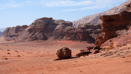 Planet Mars like landscape of Arabian Wadi Rum desert with red sand and rugged mountainous terrain in Jordan, Middle East