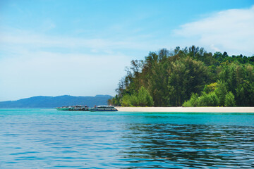 Tropical forest, sea coast, beach and sky. Phuket, Thailand. Traveling concept.