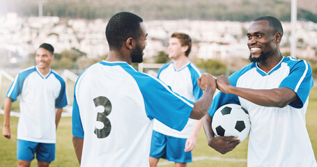 Fist bump, soccer team and fitness teamwork success of a sports group in training on a grass field. Football friends, support and exercise support with motivation outdoor for health workout and smile