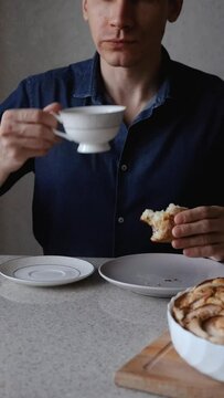 Man Drinking Tea With Apple Pie