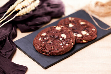 Freshly homemade chocolate cookies on a chalkboard
