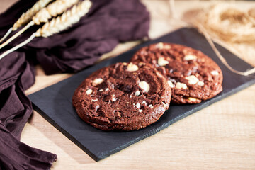 Freshly homemade chocolate cookies on a chalkboard