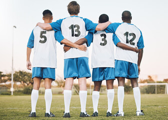 Soccer, team and hug standing with back on the field in partnership, trust or ready for sports game...