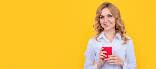 happy blond woman with coffee cup on yellow background. Woman isolated face portrait, banner with mock up copy space.