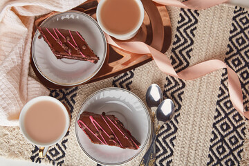 Pastel coffee time with chocolate cake, cups of coffee. St Valentines Day holiday aesthetics. Copy space