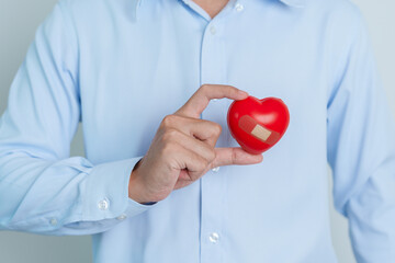 man hand holding red heart shape. love, donor, world heart day, world health day and Insurance concepts