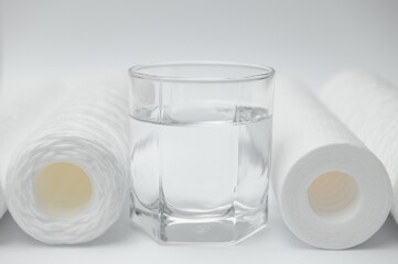 filter cartridges for water on a white background. Installation of reverse osmosis water purification system.