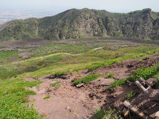 Slope of mountain Vesuvius, with landslide and broken hillside guard, after rain. Dangerous for...