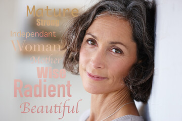 Words overlay, letter collage and portrait of a mature woman face in retirement against a wall. Positive word message, smile and isolated female with motivation text and beauty feeling empowerment © Lauren Kaylor/peopleimages.com