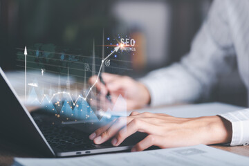 Marketer showing growth graph and SEO concept, optimization analysis tools, search engine rankings, social media sites based on results analysis data,online marketing,website ranking