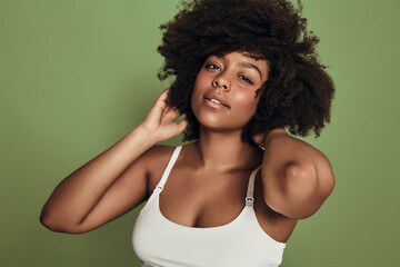 Fototapeta na wymiar Young black woman touching hair