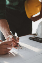 Architects and engineers are working together to edit the draft house plan that was designed after it was presented to the client and partially revised the design. Interior design and decoration ideas