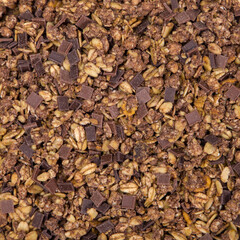 Chocolate granola background. Top view. Flat lay pattern.