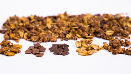 Chocolate granola, crispy muesli. Ingredients included in chocolate granola. Selective focus.