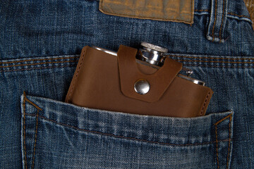 Hip flask in denim blue jeans pocket