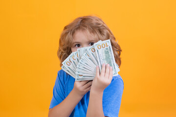 American dreams. Rich child with dollars. Lottery cashback, win big money isolated yellow background.